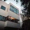 brown concrete building near trees during daytime