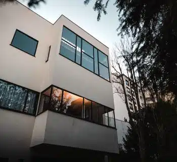 brown concrete building near trees during daytime